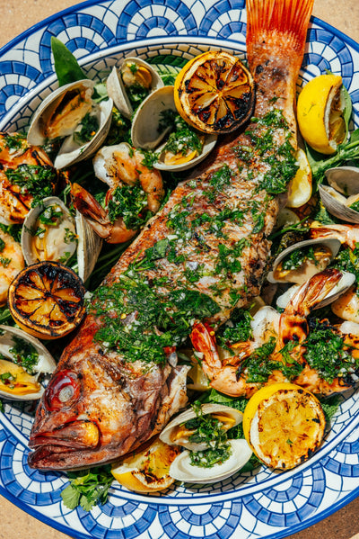 Whole Grilled Fish, Clams + Shrimp with Herb Salsa Verde